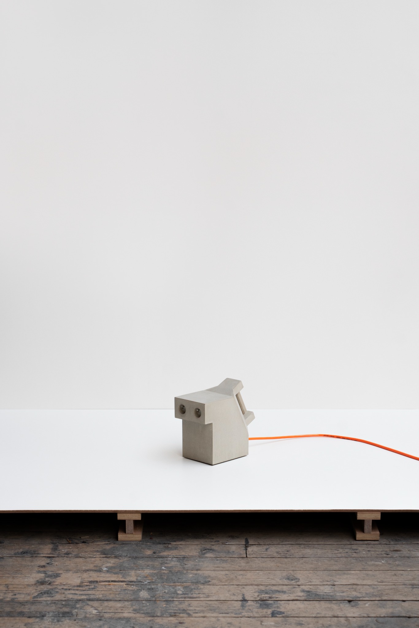 Wallee, concrete object with orange cable